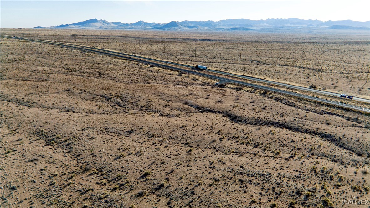 7729 West Sanctuary Road Chloride, AZ 86431 - Photo 12 of 24 a view of an ocean beach and mountain view