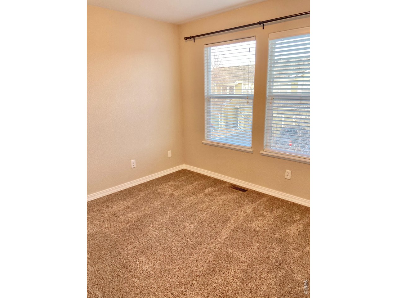 1900 68th Avenue, Unit 5 Greeley, CO 80634 - Photo 11 of 21 a view of an empty room with a window