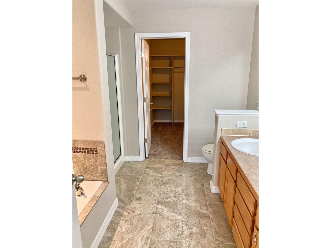 1900 68th Avenue, Unit 5 Greeley, CO 80634 - Photo 15 of 21 a view of a bathroom with a sink and a vanity