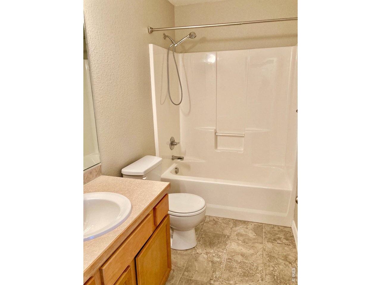 1900 68th Avenue, Unit 5 Greeley, CO 80634 - Photo 17 of 21 a bathroom with a sink toilet and shower