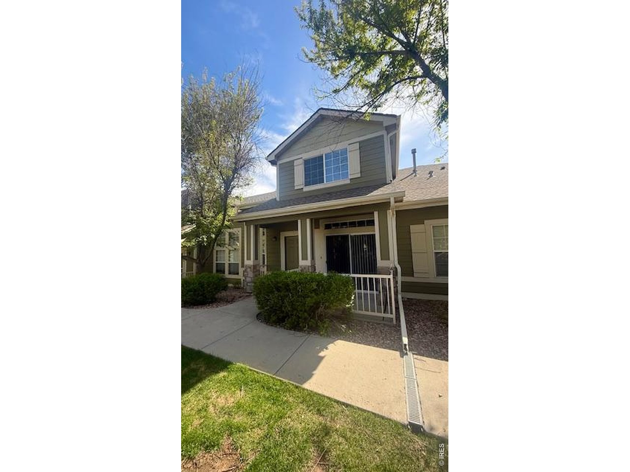 1900 68th Avenue, Unit 5 Greeley, CO 80634 - Photo 19 of 21 a house view with a garden space