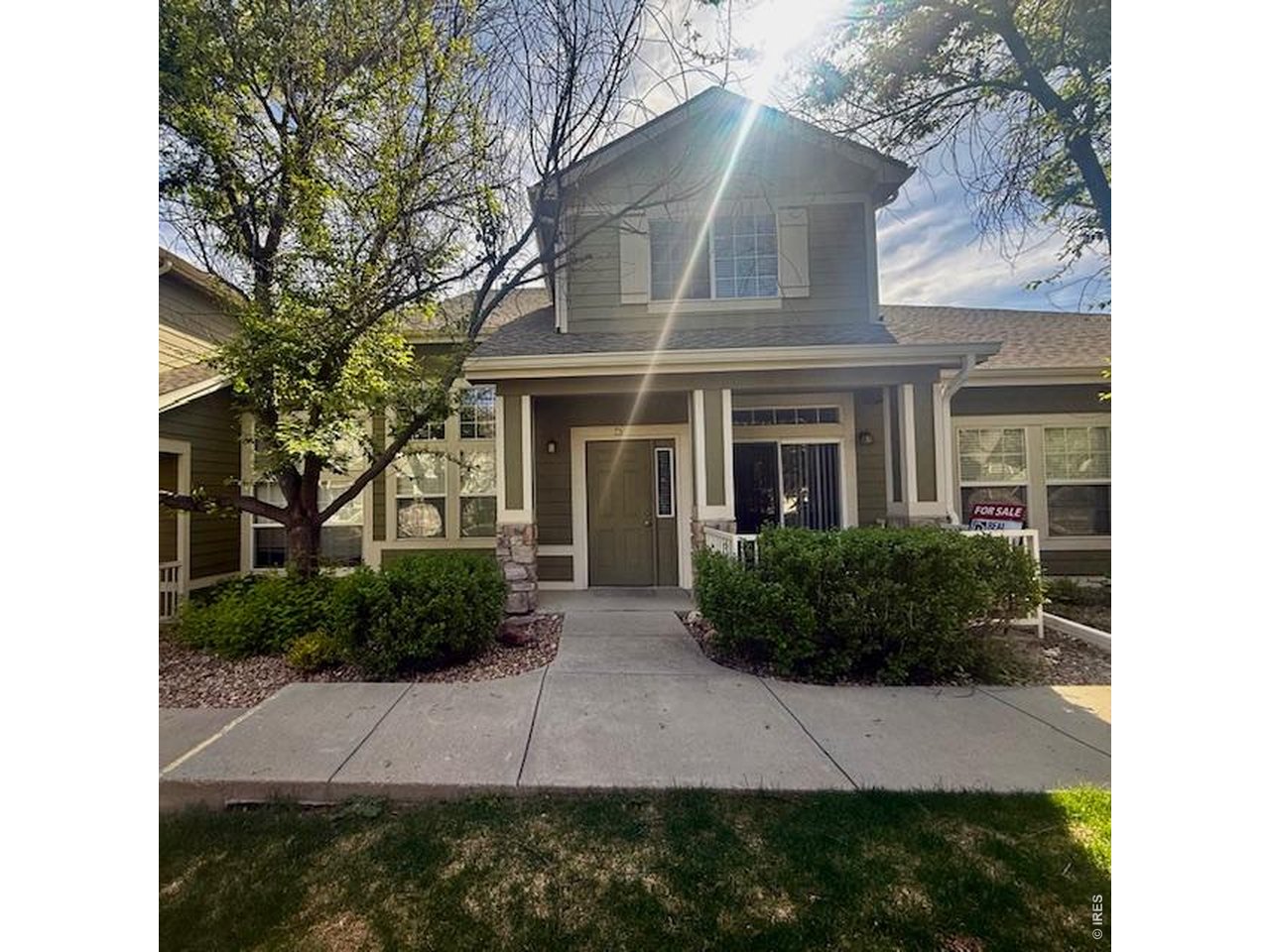 1900 68th Avenue, Unit 5 Greeley, CO 80634 - Photo 20 of 21 a view of a yard in front of a house