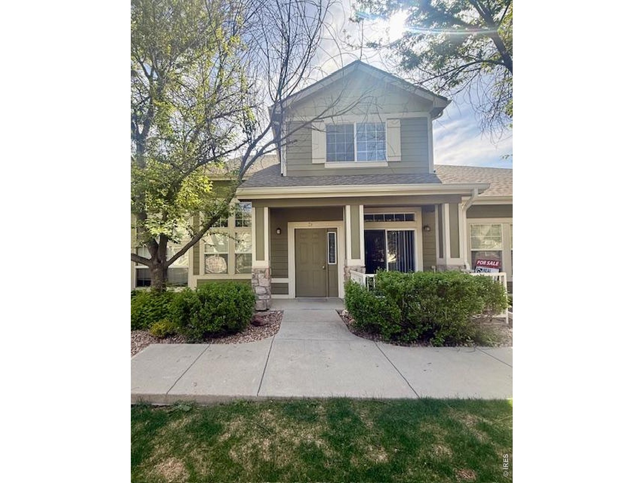 1900 68th Avenue, Unit 5 Greeley, CO 80634 - Photo 21 of 21 a front view of a house with garden