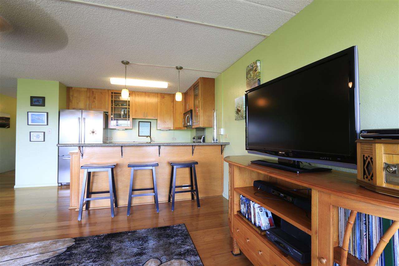 2387 South Kihei Road, Unit C302 Kihei, HI 96753 - Photo 11 of 17 a room with furniture and a flat screen tv