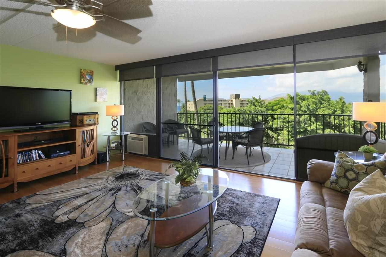 2387 South Kihei Road, Unit C302 Kihei, HI 96753 - Photo 12 of 17 a living room with furniture and a flat screen tv