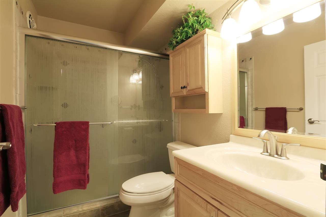 2387 South Kihei Road, Unit C302 Kihei, HI 96753 - Photo 13 of 17 a bathroom with a sink a toilet a shower and a mirror