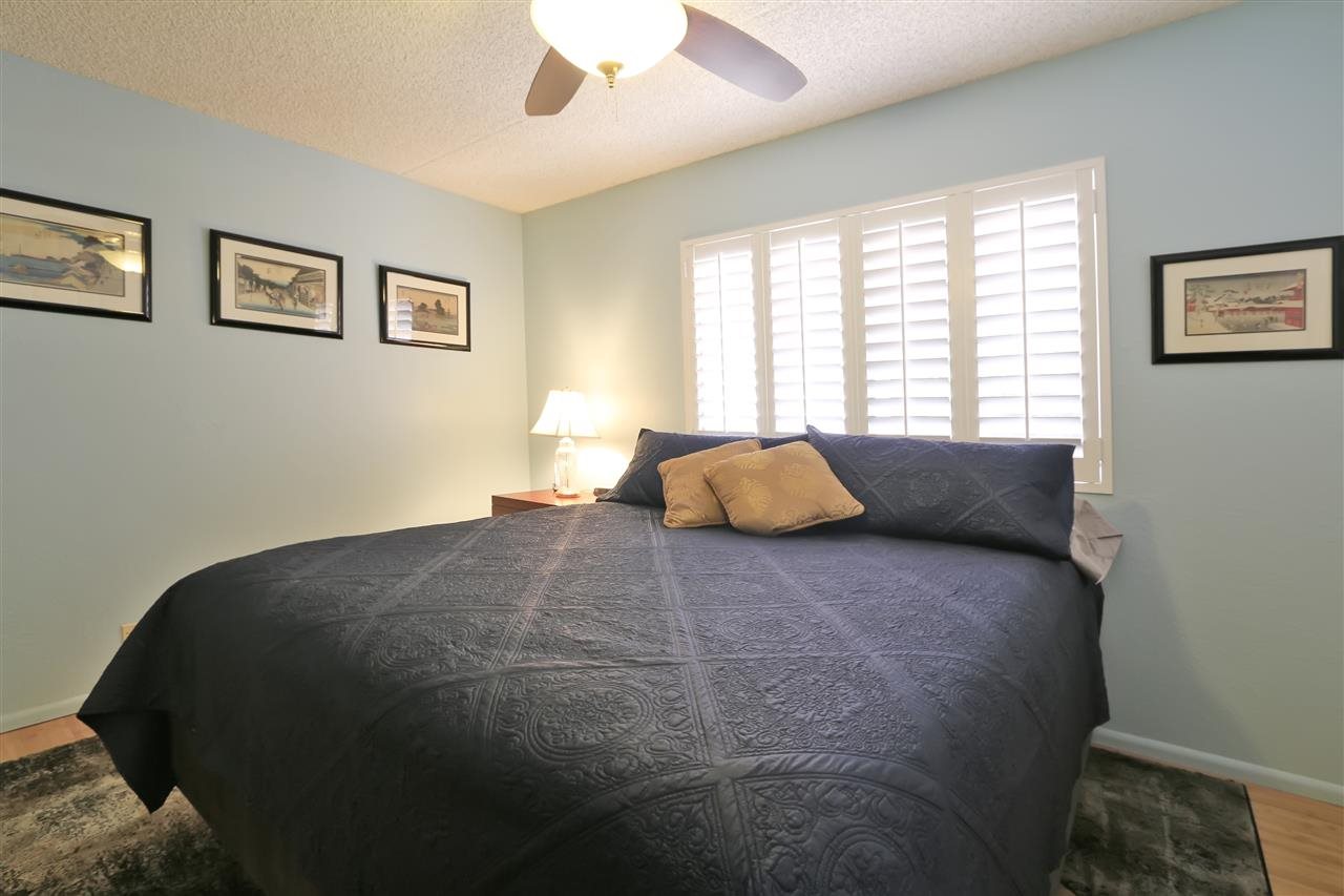 2387 South Kihei Road, Unit C302 Kihei, HI 96753 - Photo 15 of 17 a large bed sitting in a bedroom next to a window