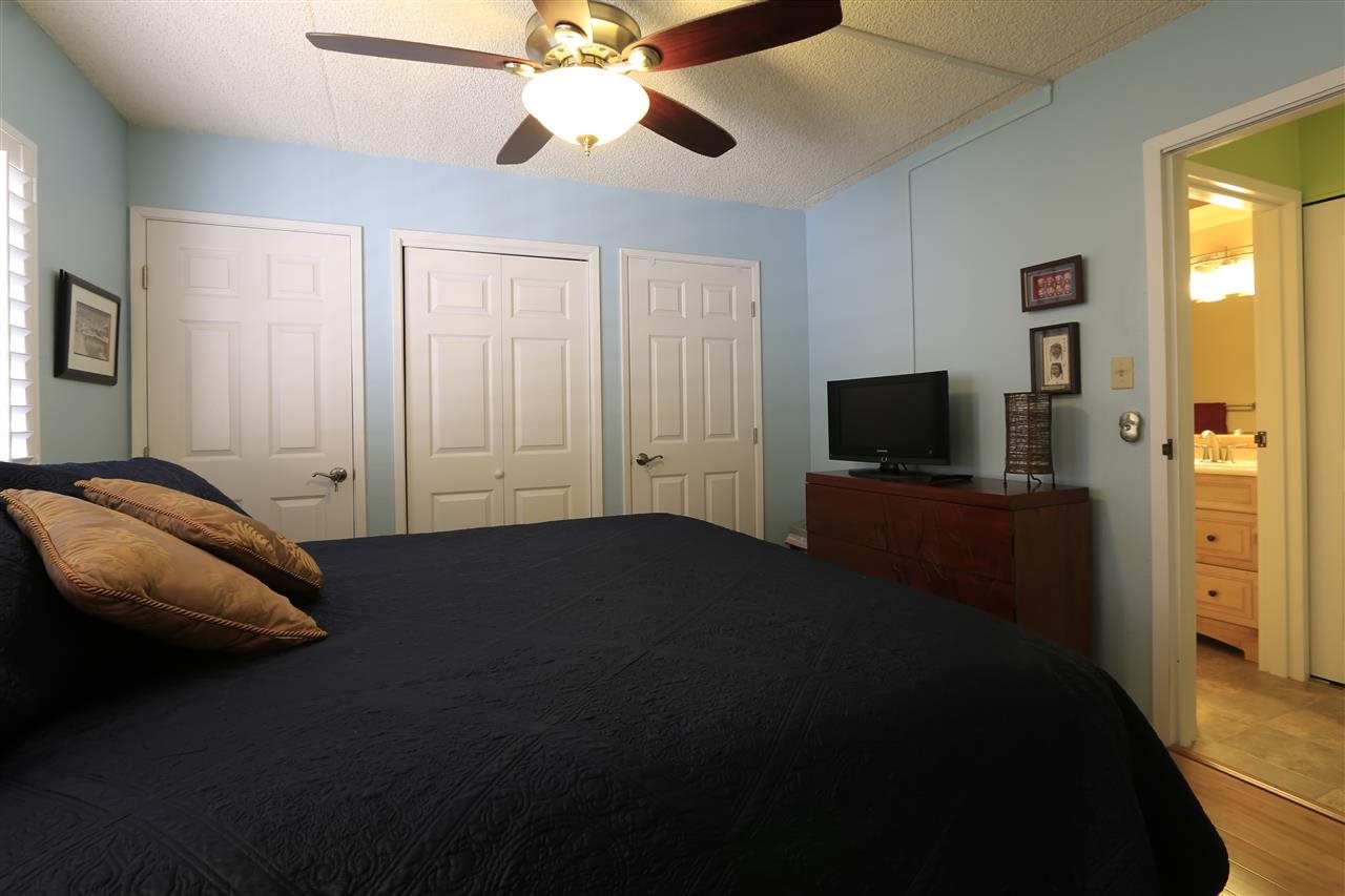 2387 South Kihei Road, Unit C302 Kihei, HI 96753 - Photo 16 of 17 a bedroom with a bed and a flat tv screen