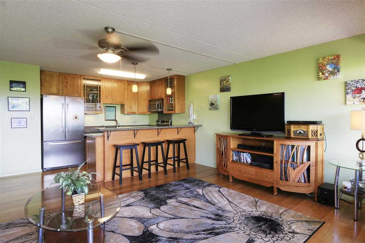 2387 South Kihei Road, Unit C302 Kihei, HI 96753 - Photo 6 of 17 a living room with furniture and a flat screen tv