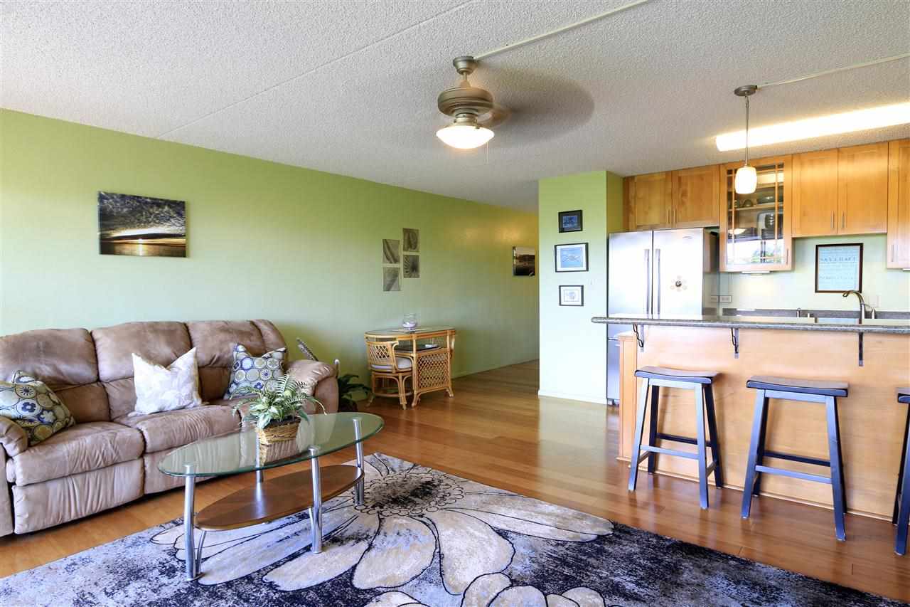 2387 South Kihei Road, Unit C302 Kihei, HI 96753 - Photo 7 of 17 a living room with furniture wooden floor and a large window