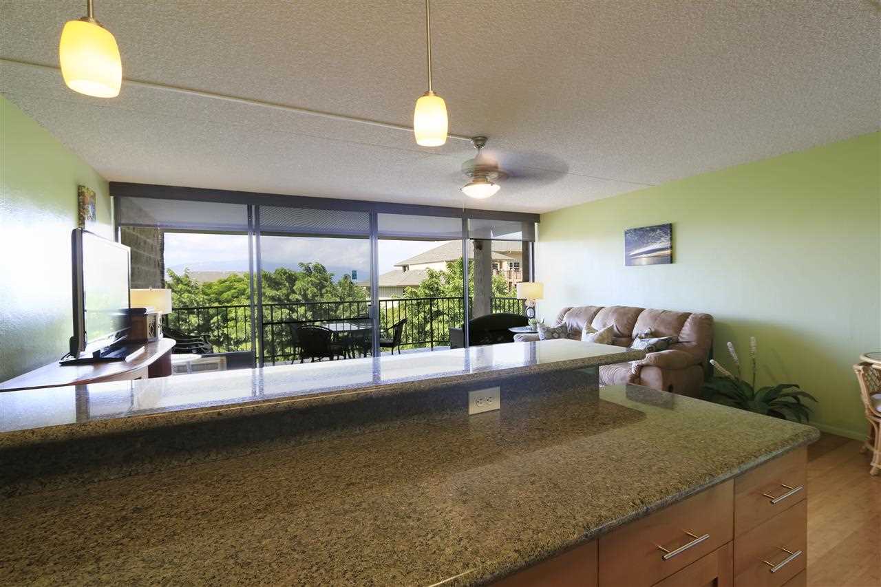 2387 South Kihei Road, Unit C302 Kihei, HI 96753 - Photo 8 of 17 a living room with furniture and a large window