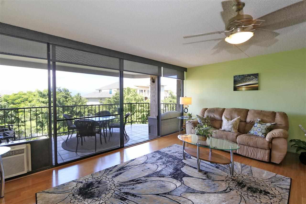 2387 South Kihei Road, Unit C302 Kihei, HI 96753 - Photo 9 of 17 a living room with furniture and a large window