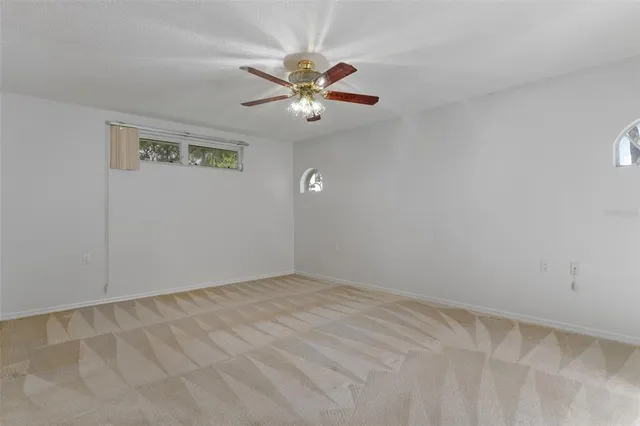 a view of a balcony with chairs and potted plants