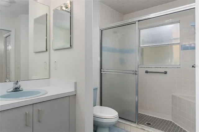 an aerial view of residential houses with outdoor space and river