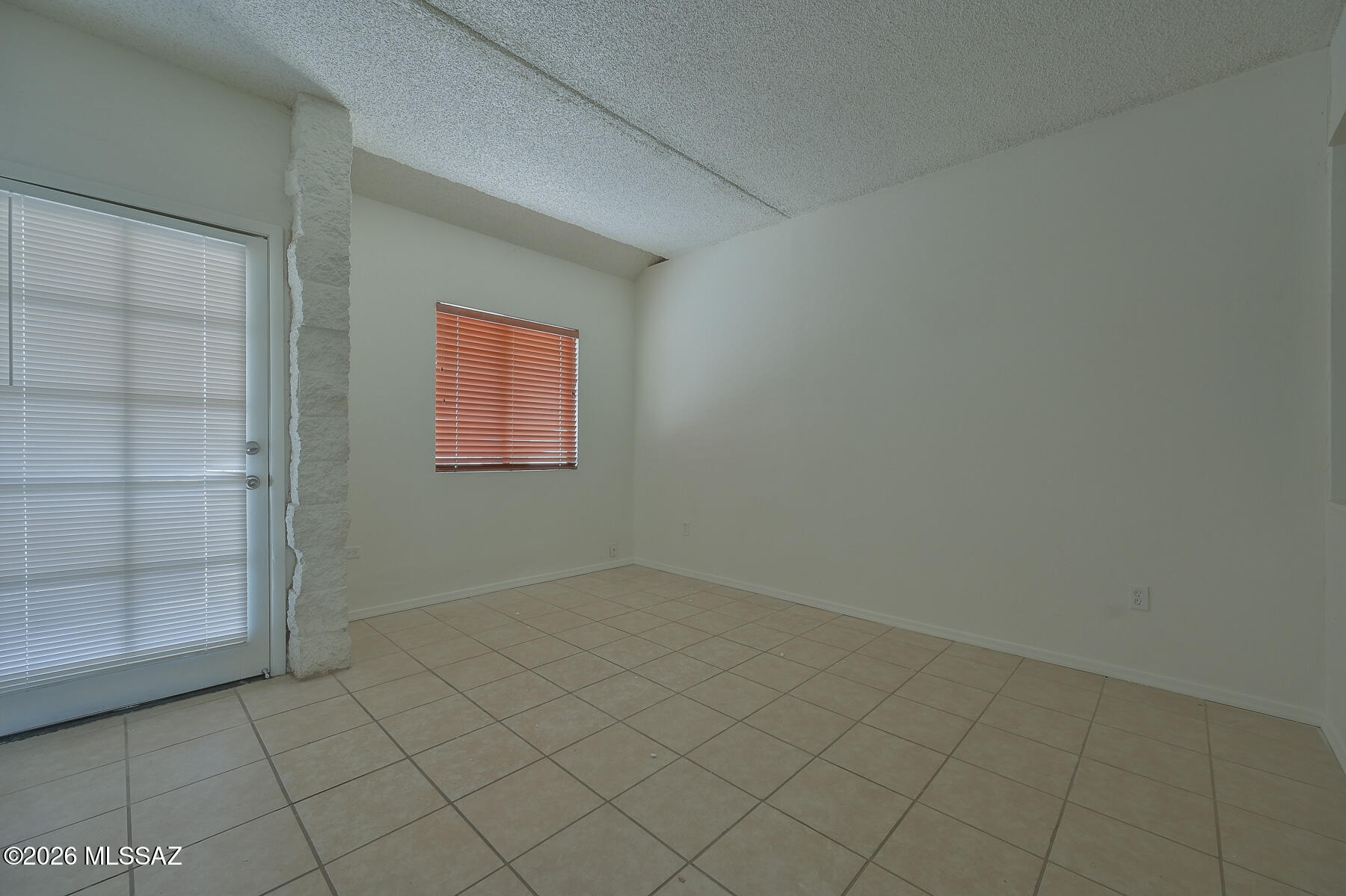 7777 East Golf Links Road, Unit 2308 Tucson, AZ 85730 - Photo 16 of 37 an empty room with windows