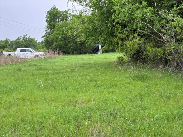 a view of lake with green space