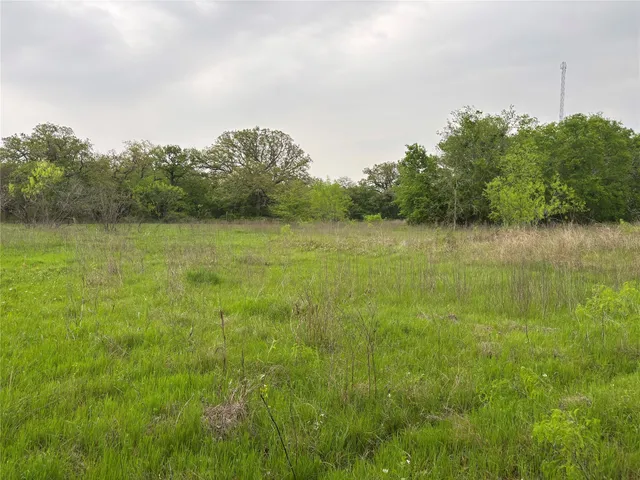 a view of a lake with houses in the back