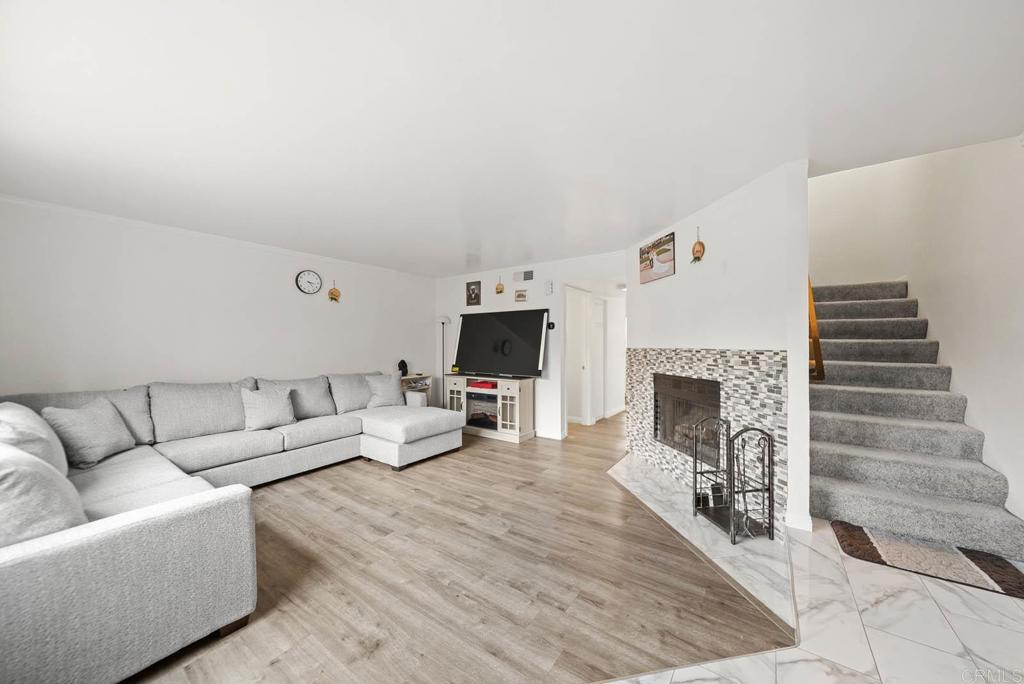 2636 Alpine Boulevard, Unit C Alpine, CA 91901 - Photo 1 of 35 a living room with furniture and a fireplace