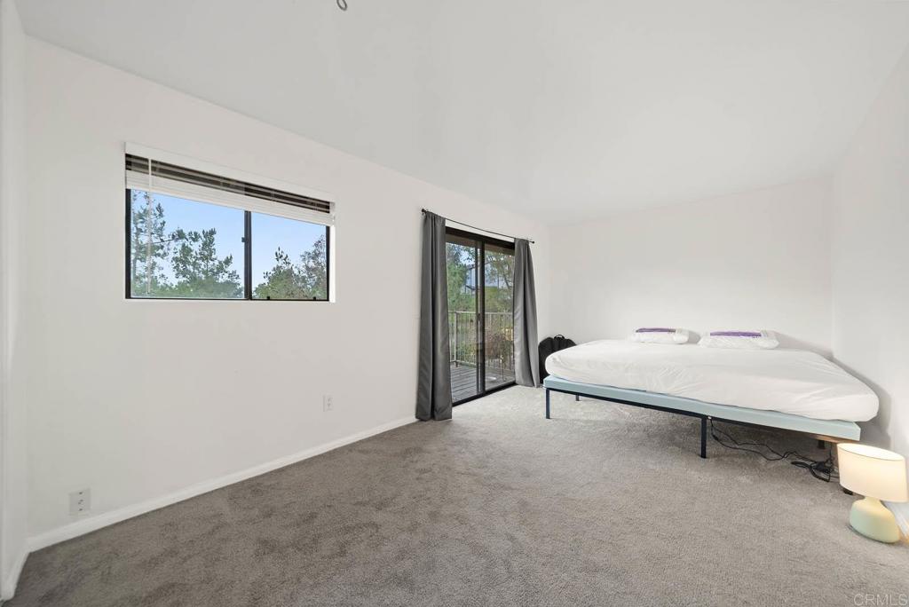 2636 Alpine Boulevard, Unit C Alpine, CA 91901 - Photo 11 of 35 a bedroom with a bed and a painting on the wall