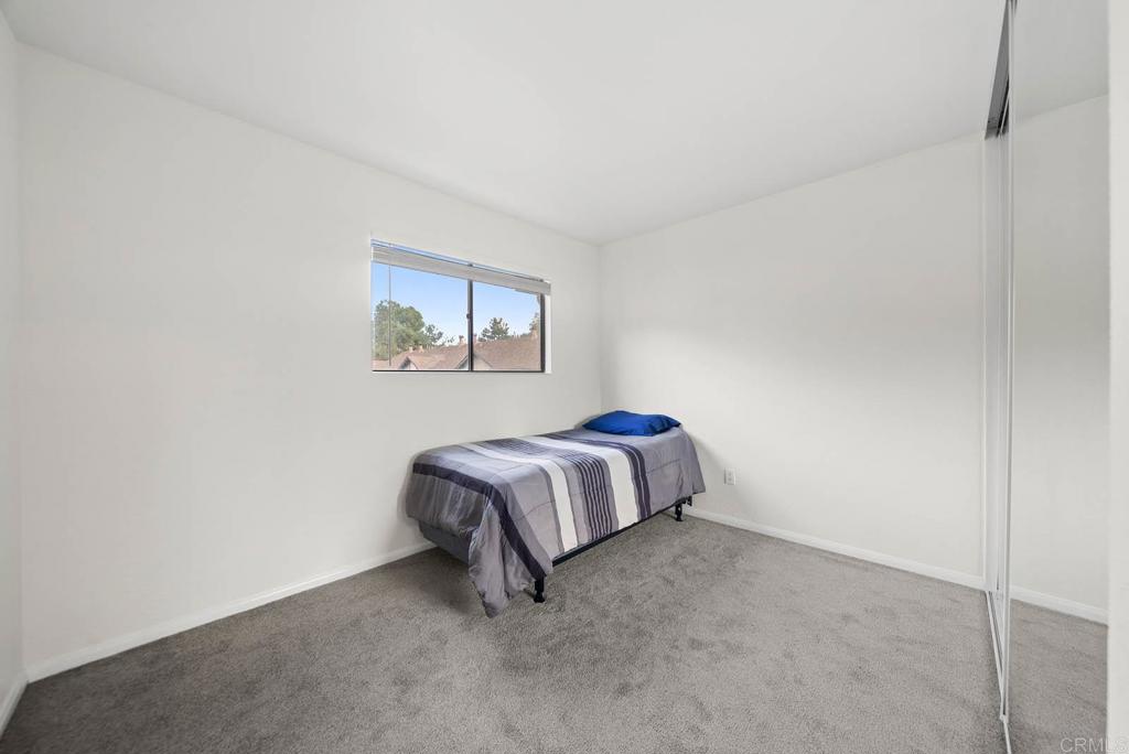 2636 Alpine Boulevard, Unit C Alpine, CA 91901 - Photo 12 of 35 a bedroom with a bed and a wall painting