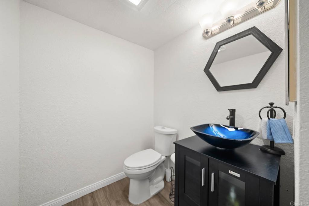 2636 Alpine Boulevard, Unit C Alpine, CA 91901 - Photo 17 of 35 a bathroom with a toilet a sink and mirror