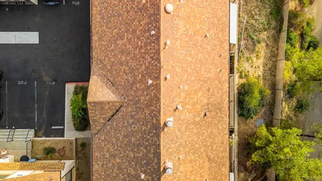 an aerial view of a house with a swimming pool