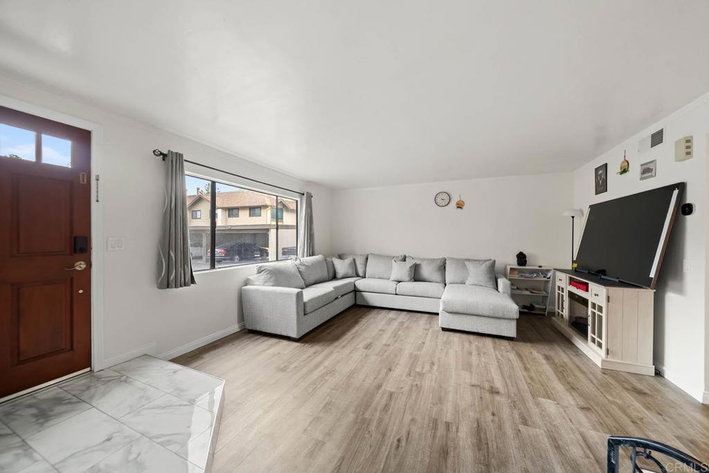 2636 Alpine Boulevard, Unit C Alpine, CA 91901 - Photo 5 of 35 a living room with furniture and a flat screen tv