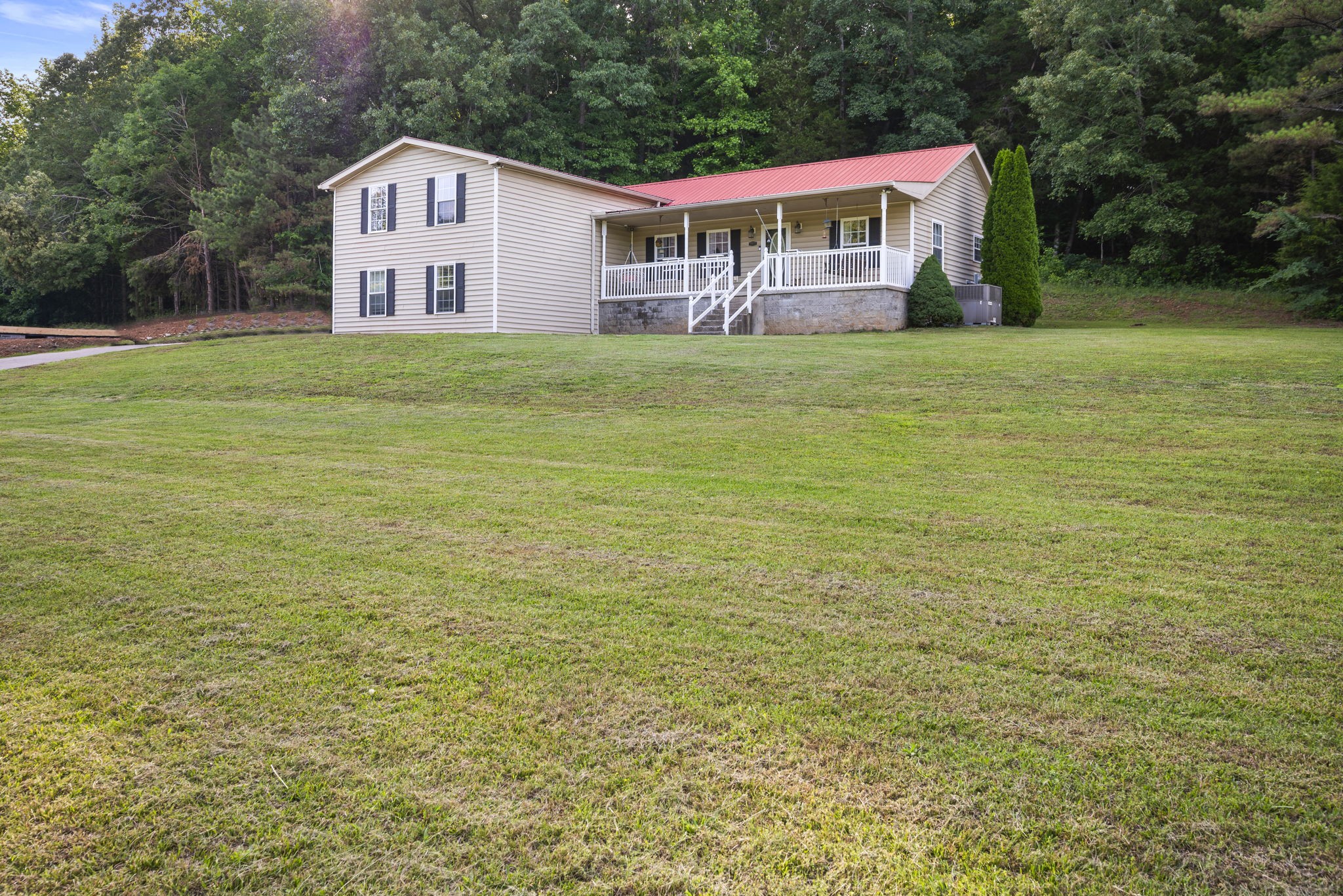 1197 Biter Road Cunningham, TN 37052 - Photo 35 of 38 a house with a yard in front of it