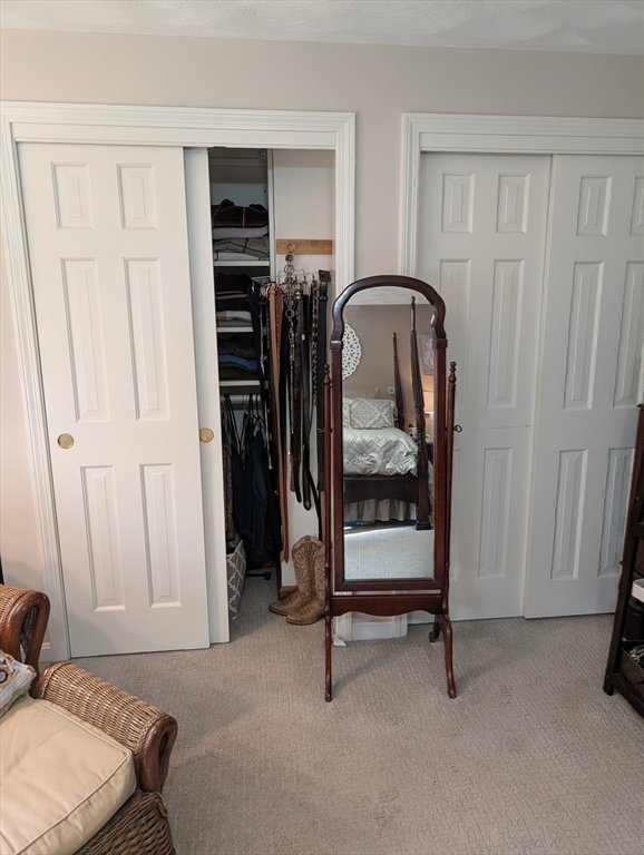 251 Wellman Avenue, Unit 251 Chelmsford, MA 01863 - Photo 22 of 42 a bedroom with a bed and a window