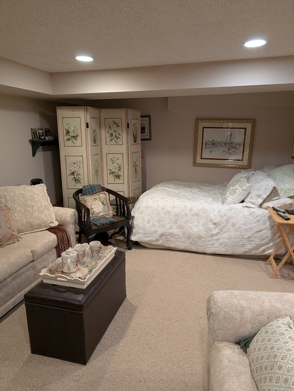 251 Wellman Avenue, Unit 251 Chelmsford, MA 01863 - Photo 31 of 42 a living room with furniture and a couch