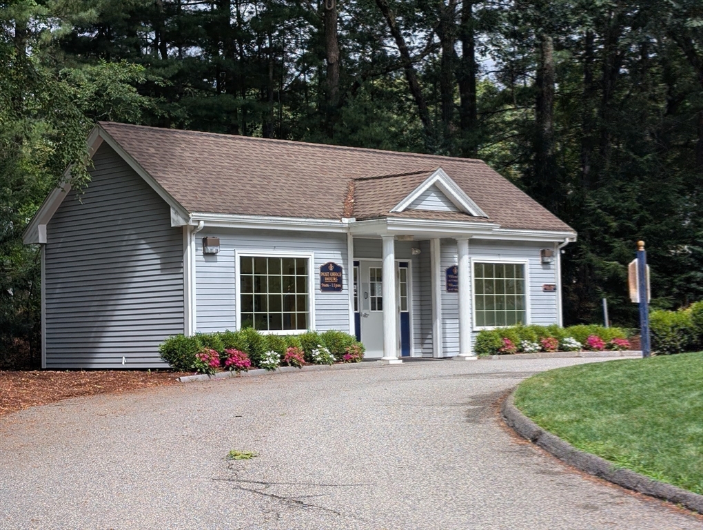 251 Wellman Avenue, Unit 251 Chelmsford, MA 01863 - Photo 39 of 42 a front view of a house with a yard and outdoor seating