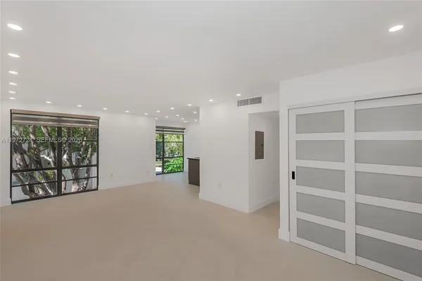 a view of an empty room with a window
