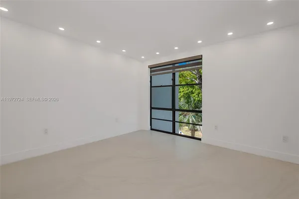 a bathroom with a glass shower door