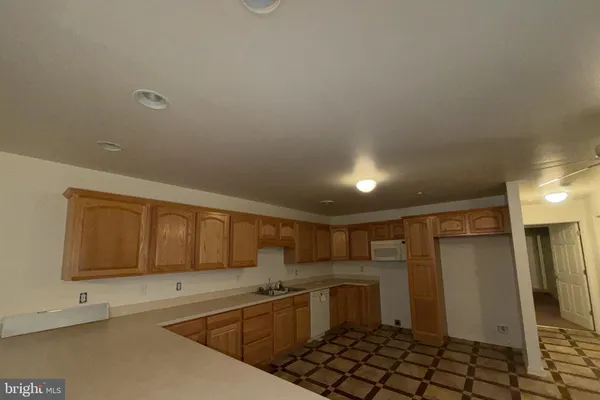 a kitchen with a sink and cabinets