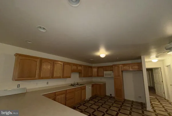a kitchen with a sink and cabinets