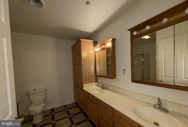 a bathroom with a glass door shower