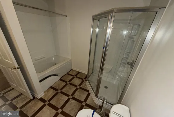 a bathroom with a sink mirror vanity and toilet