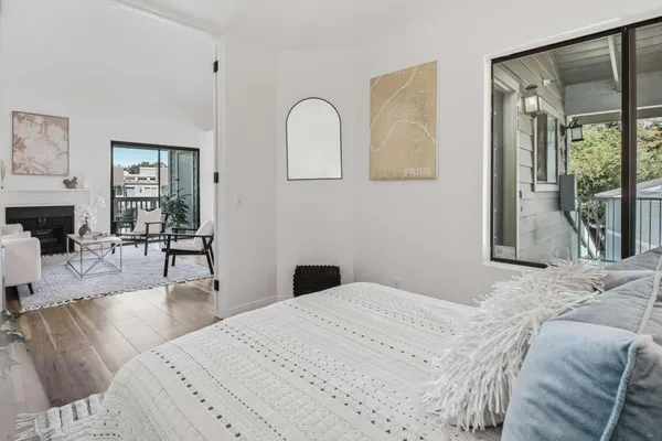 a bedroom with a bed and window