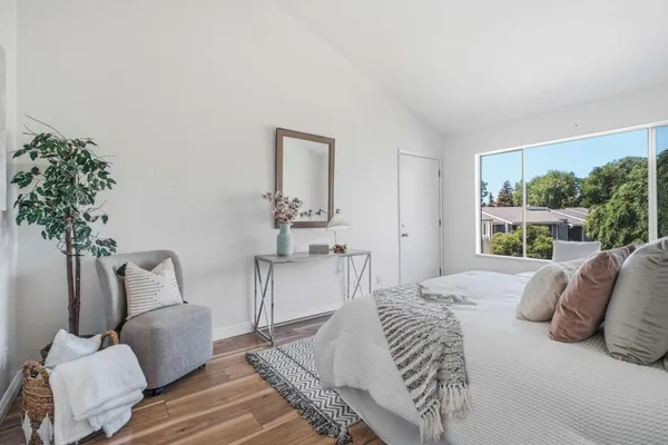 a bedroom with a bed and a couch