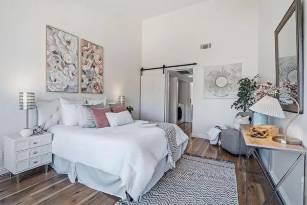 a bedroom with a bed and a table