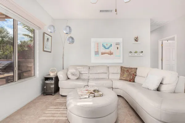 a living room with furniture and a large window
