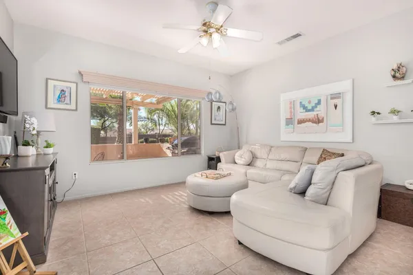 a living room with furniture and a large window