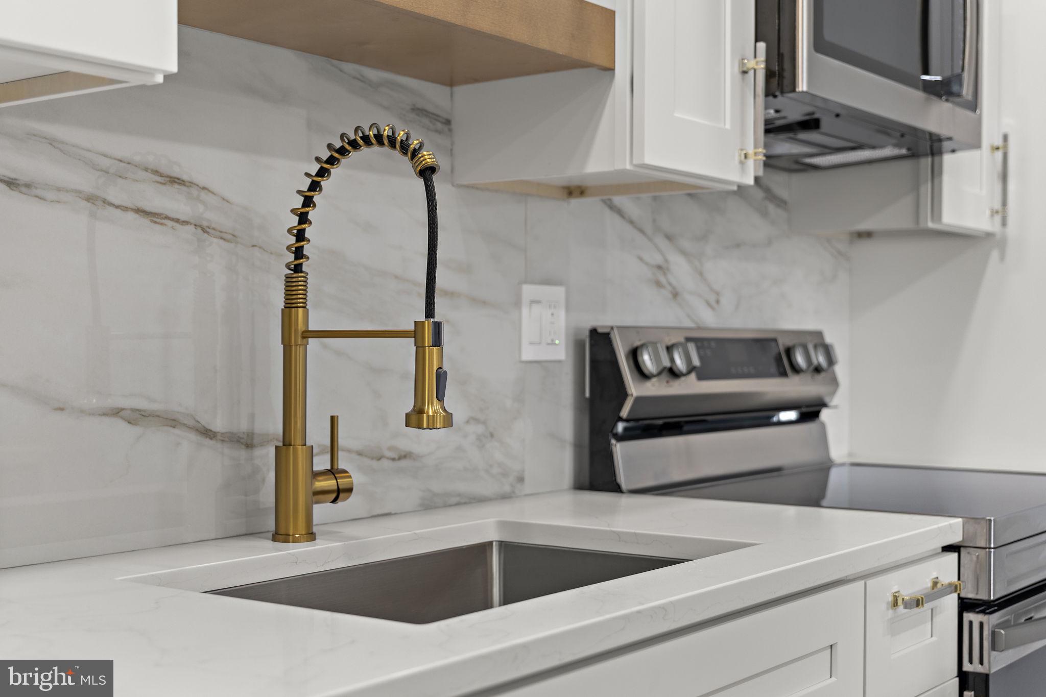 19605 Gunners Branch Road, Unit D Germantown, MD 20876 - Photo 12 of 36 a utility room with sink dryer and washer