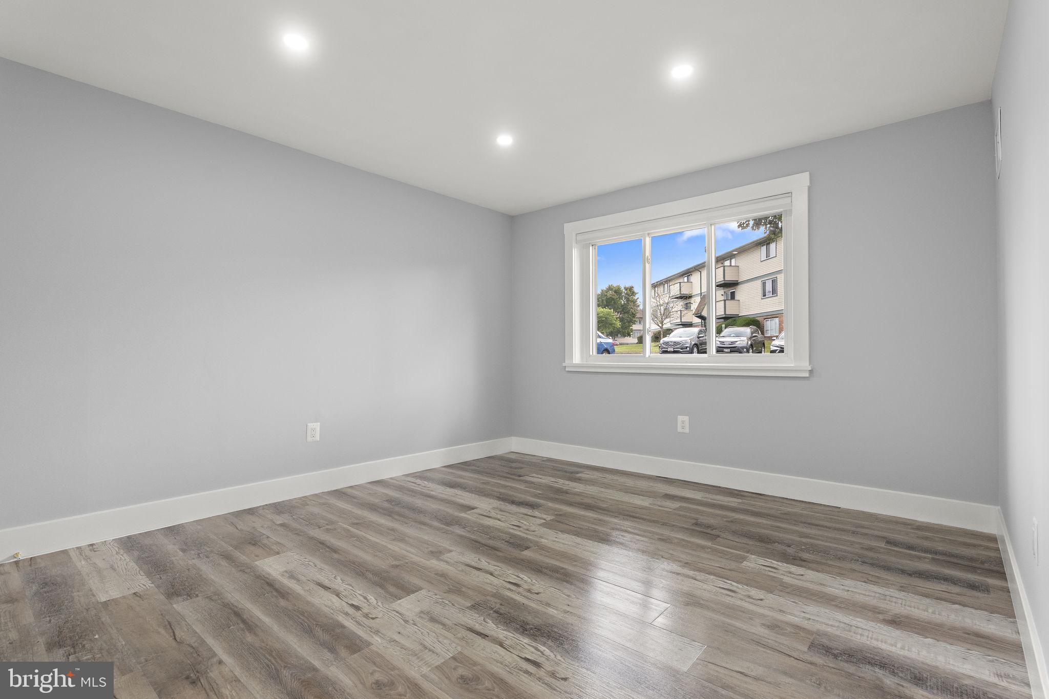 19605 Gunners Branch Road, Unit D Germantown, MD 20876 - Photo 14 of 36 a view of empty room with wooden floor