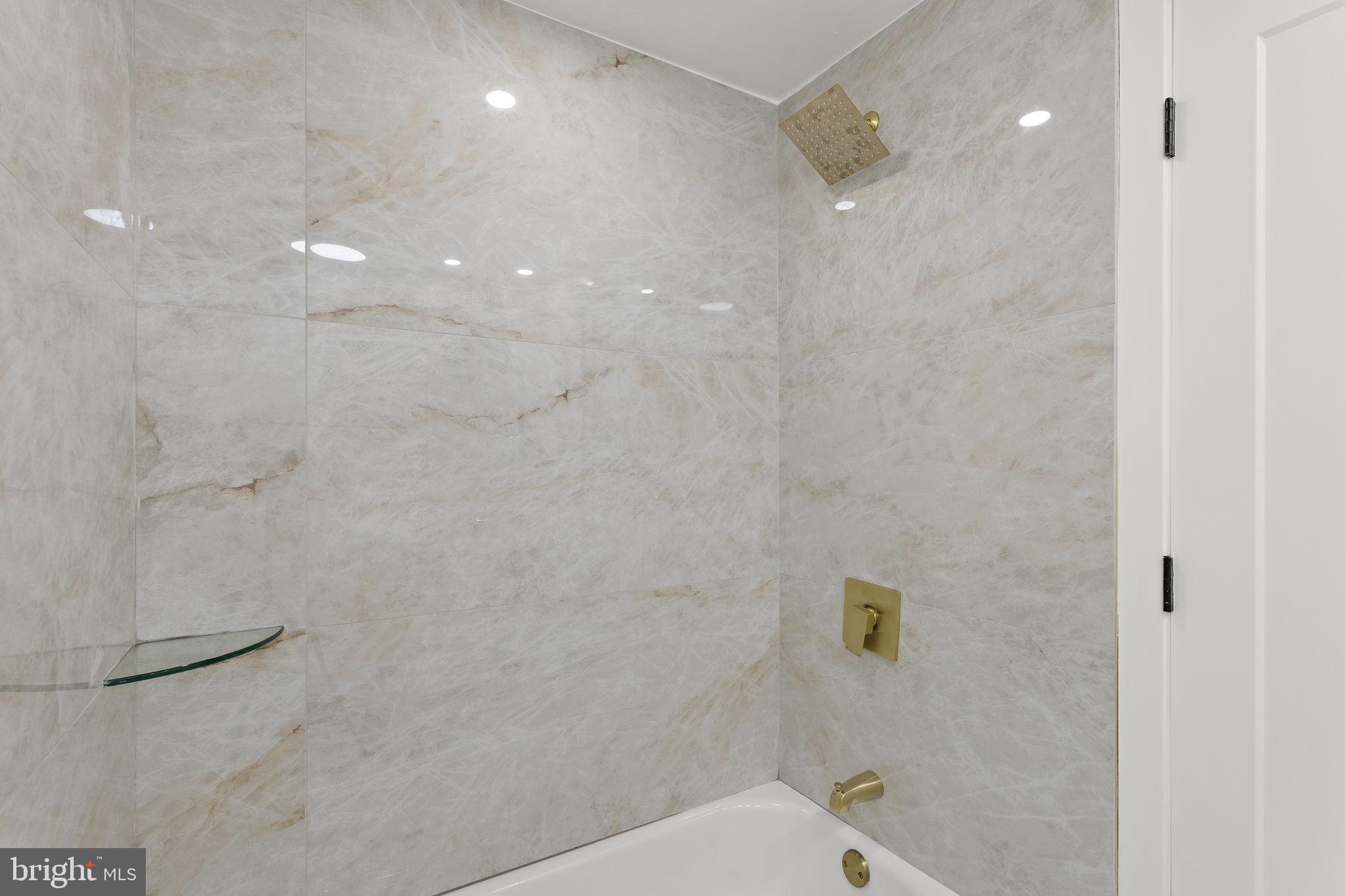 19605 Gunners Branch Road, Unit D Germantown, MD 20876 - Photo 18 of 36 a bathroom with a shower and a toilet