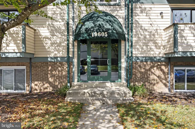 a view of a brick house with a large windows
