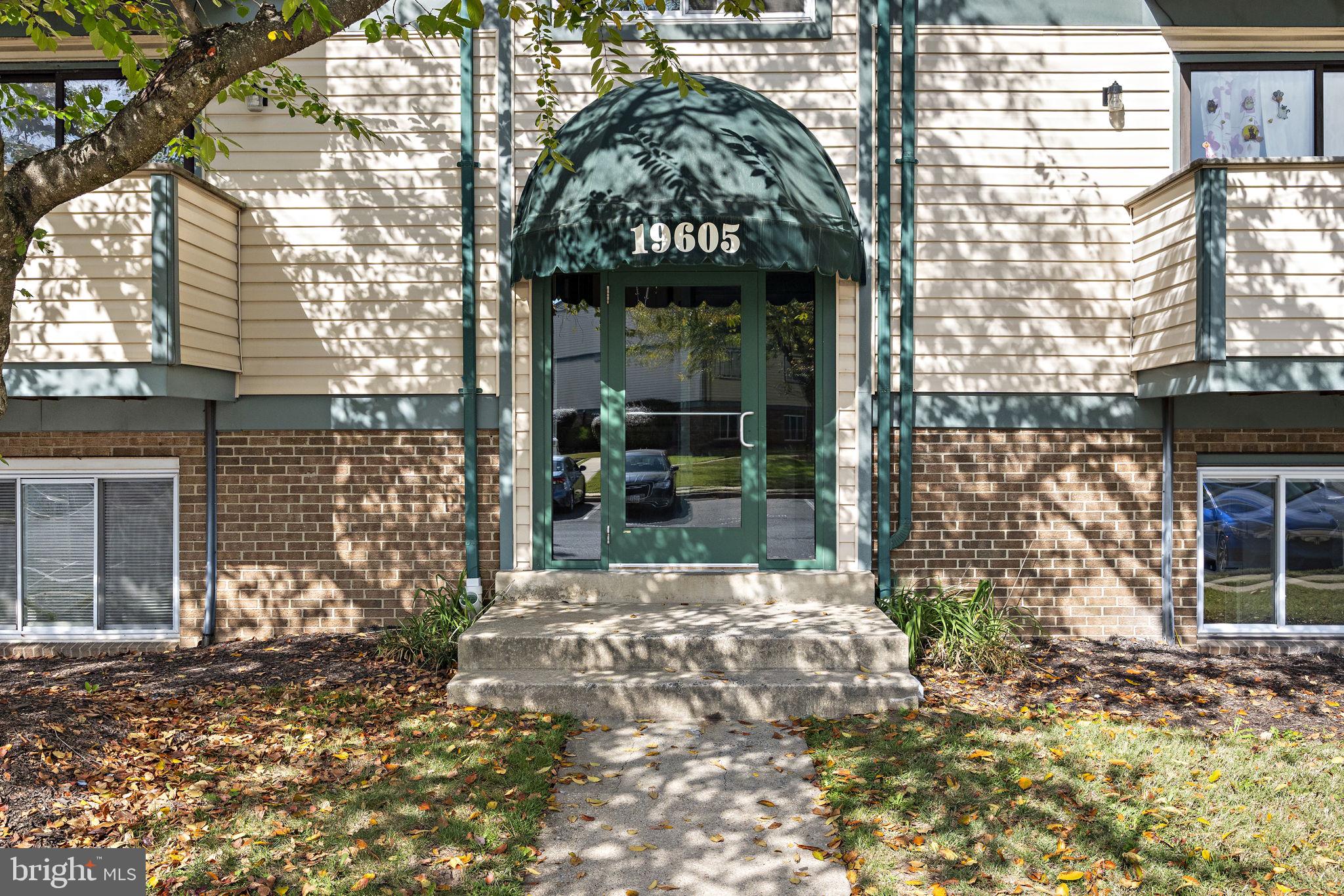 19605 Gunners Branch Road, Unit D Germantown, MD 20876 - Photo 5 of 36 a view of a brick house with a large windows