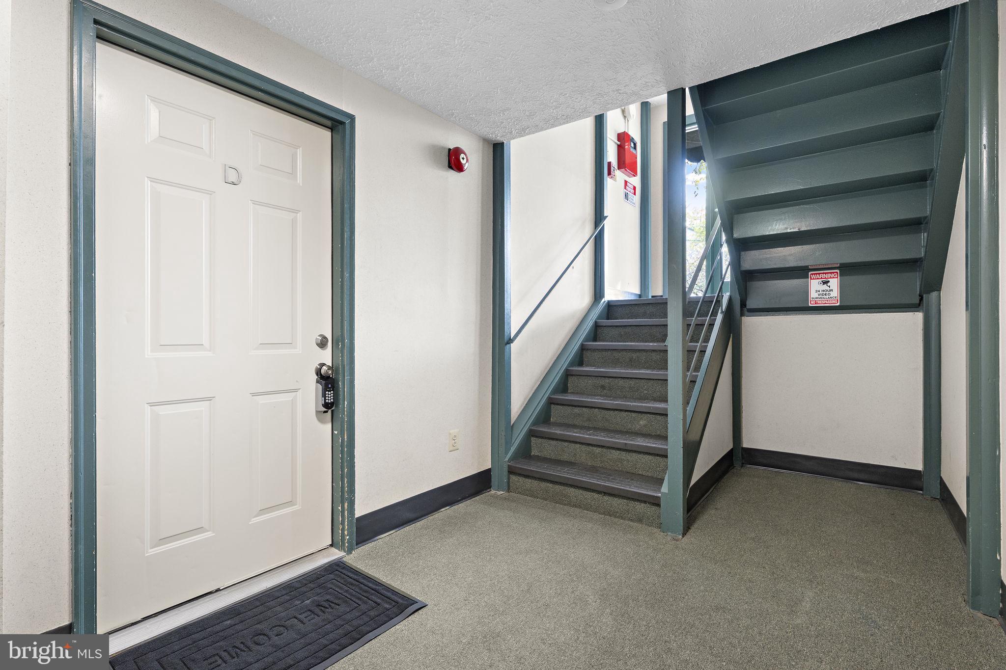 19605 Gunners Branch Road, Unit D Germantown, MD 20876 - Photo 6 of 36 a view of an entryway with stairs