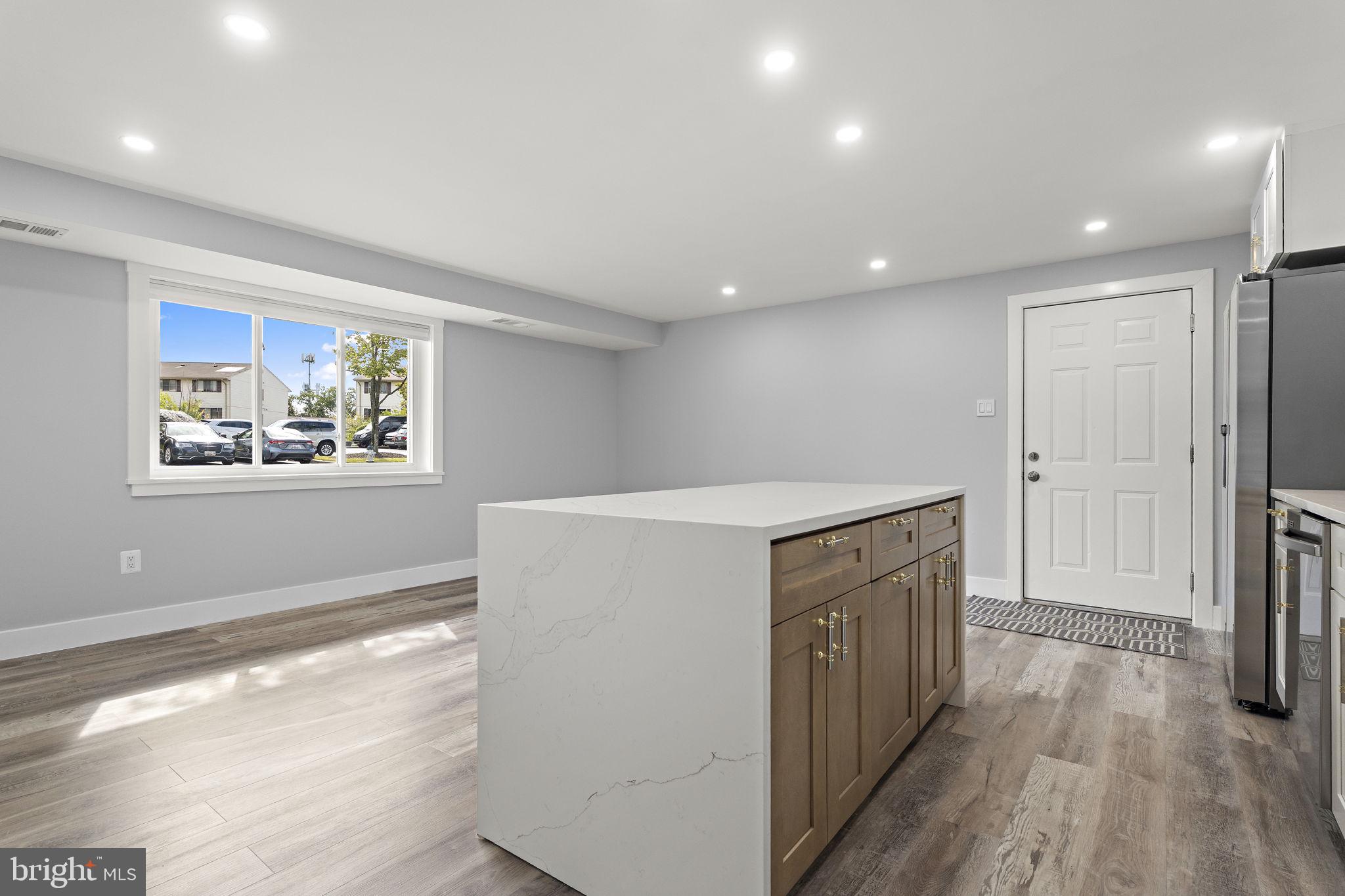 19605 Gunners Branch Road, Unit D Germantown, MD 20876 - Photo 8 of 36 a view of a hallway with wooden floor