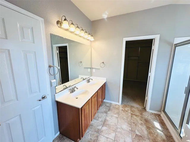 a spacious bathroom with a tub and a shower